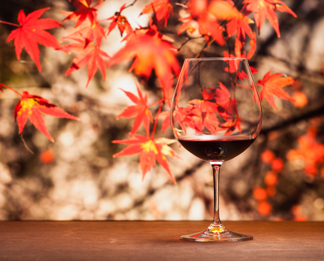 Wine in maple leaf background