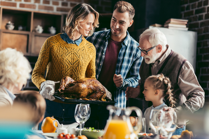 family looking at thanksgiving turkey