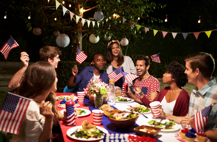 Friends Celebrating 4th Of July Holiday With Backyard Party